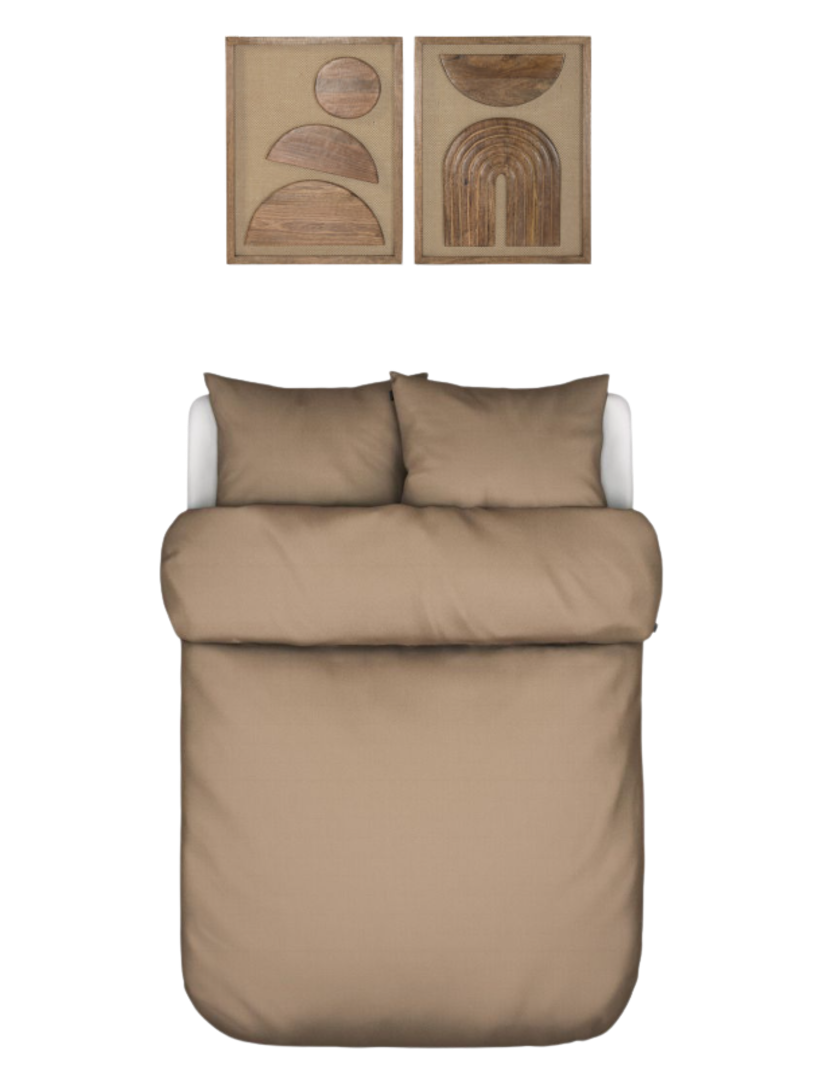 Second bedroom — caramel washed-linen bedding beneath a pair of carved-wood arch artworks