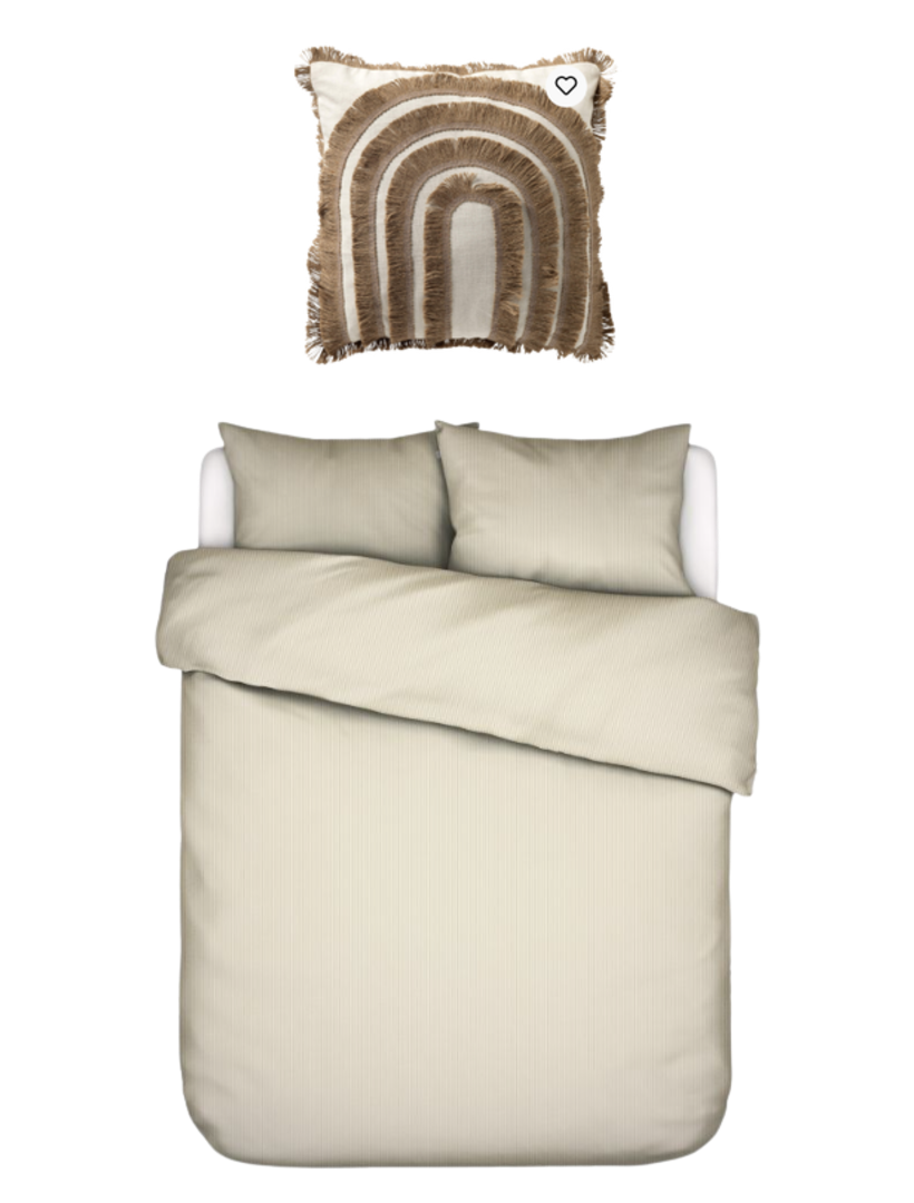 Third bedroom — cream washed-linen bedding beneath an arched fringe wall piece